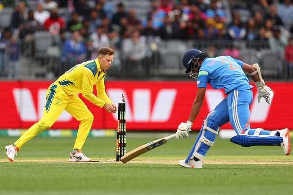 Matthew Kuhnemann with an attempted run-out against India